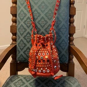 Buttery orange leather hardware studded bag